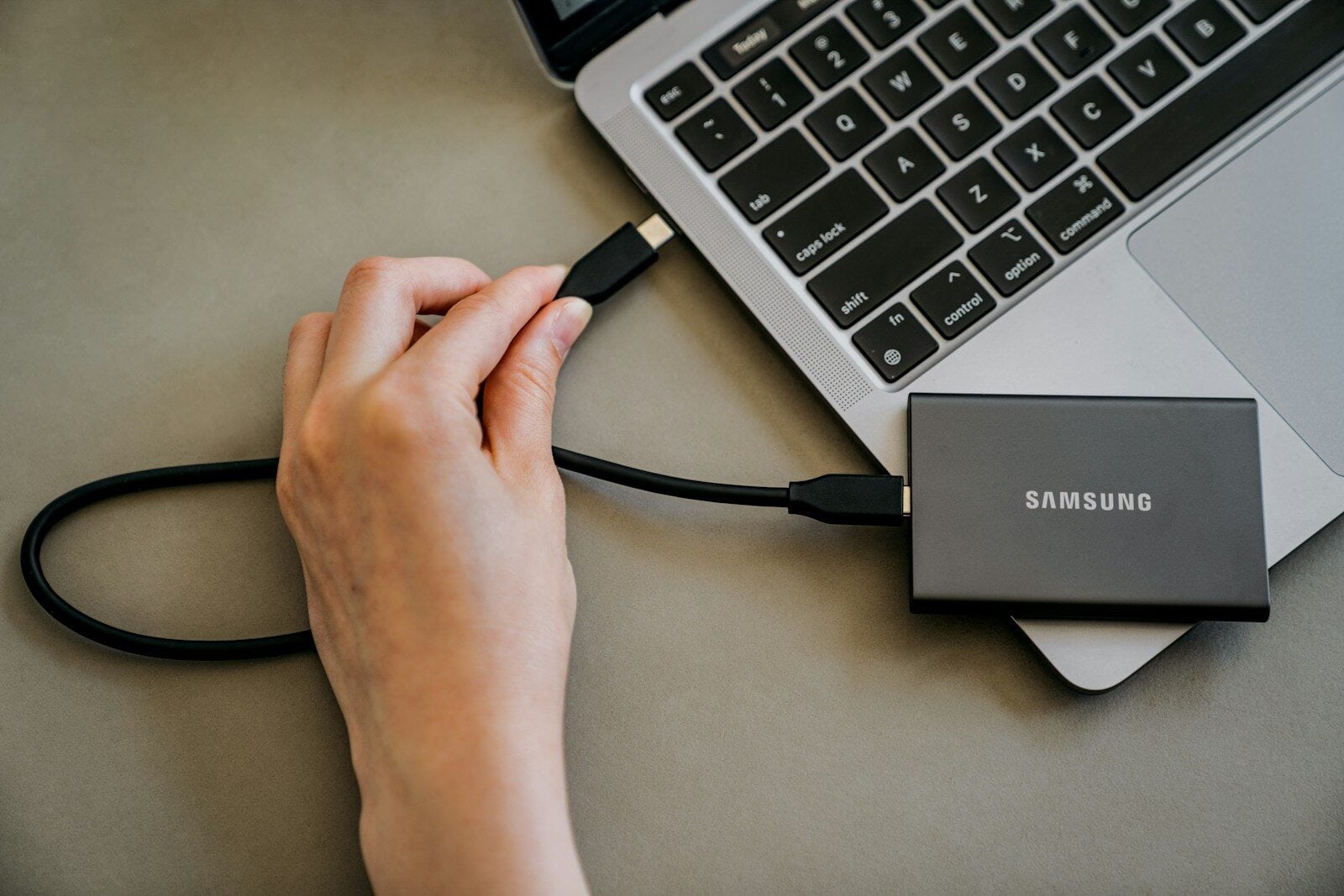 External SSD connected to a laptop External SSD connected to a laptop